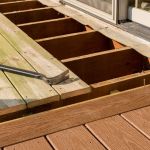 Repair and replacement of an old wooden deck or patio with modern composite plastic material