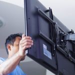 Installing mount TV on the wall at home or office