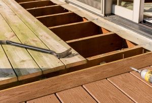 Repair and replacement of an old wooden deck or patio with modern composite plastic material